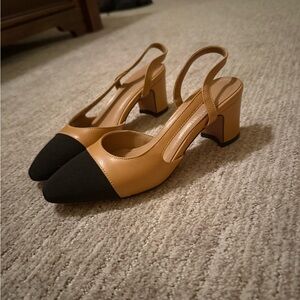 Classy never used tan and black sling back pumps size 6.5